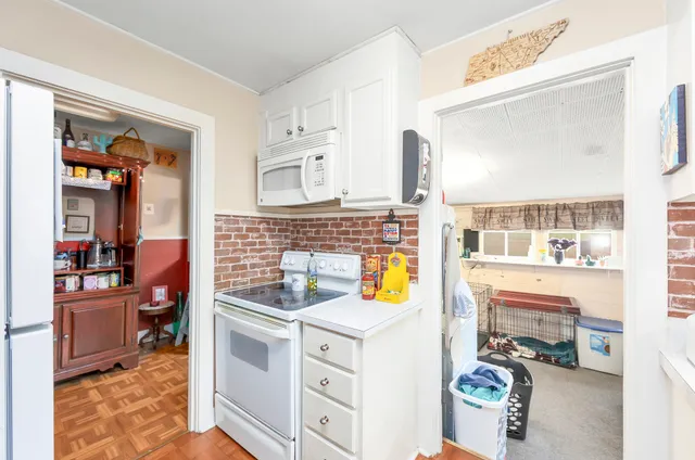 a kitchen with a stove and a refrigerator