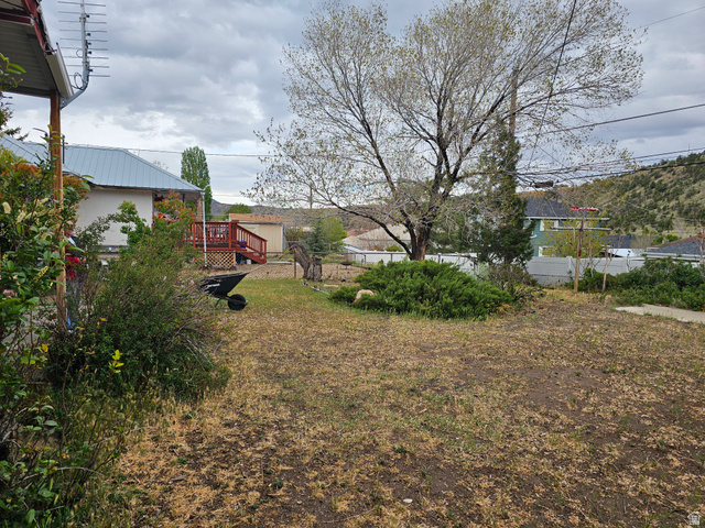 744 Royal Street Helper, UT 84526 - Photo 33 of 33 View of yard featuring a deck