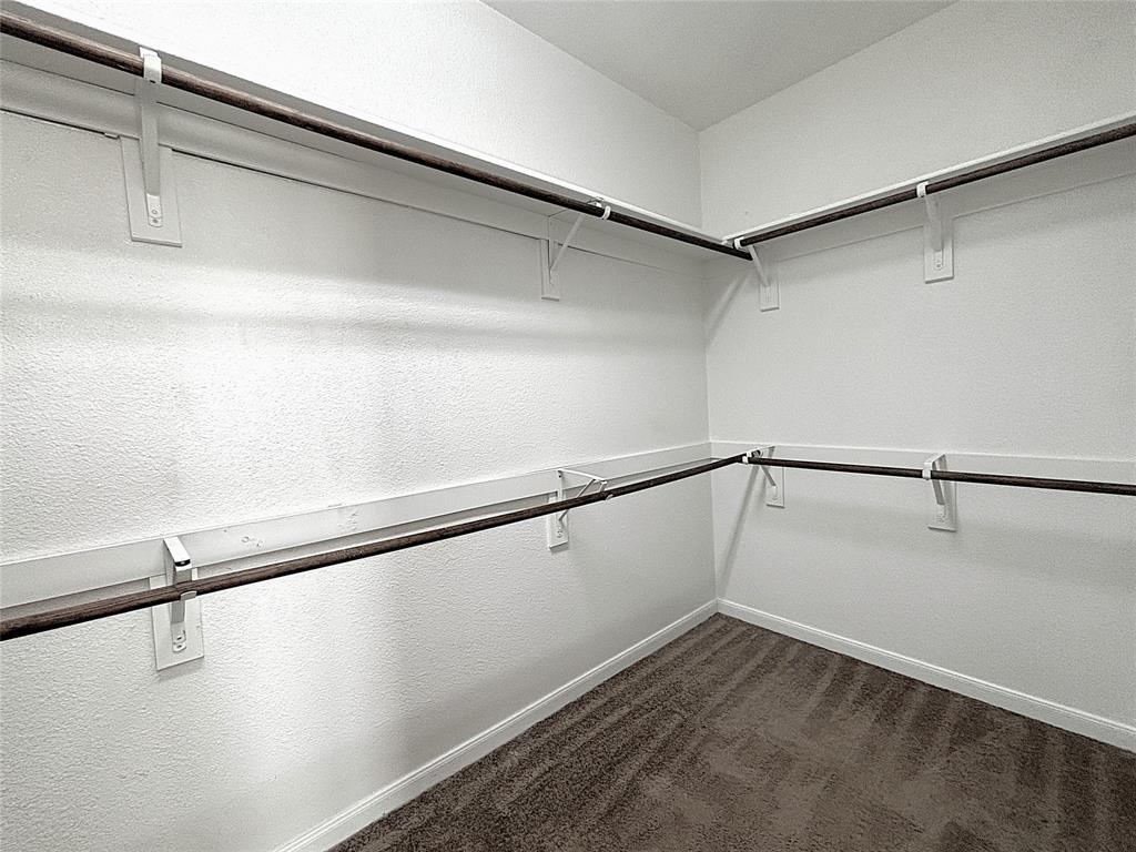 9435 Smoke Tree Drive Forney, TX 75126 - Photo 19 of 36 a view of a room with racks on the wall