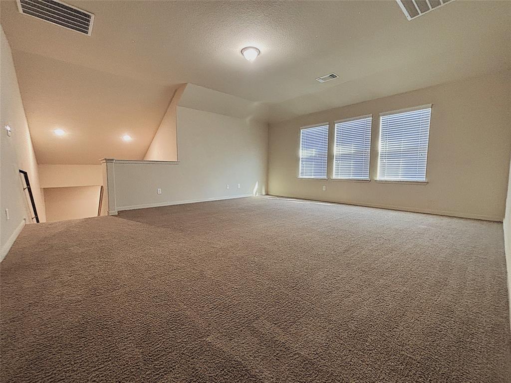 9435 Smoke Tree Drive Forney, TX 75126 - Photo 23 of 36 a view of an empty room with a window