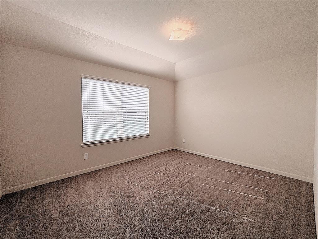 9435 Smoke Tree Drive Forney, TX 75126 - Photo 27 of 36 an empty room with a window
