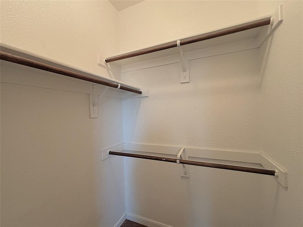 9435 Smoke Tree Drive Forney, TX 75126 - Photo 32 of 36 a view of a room with racks on the wall