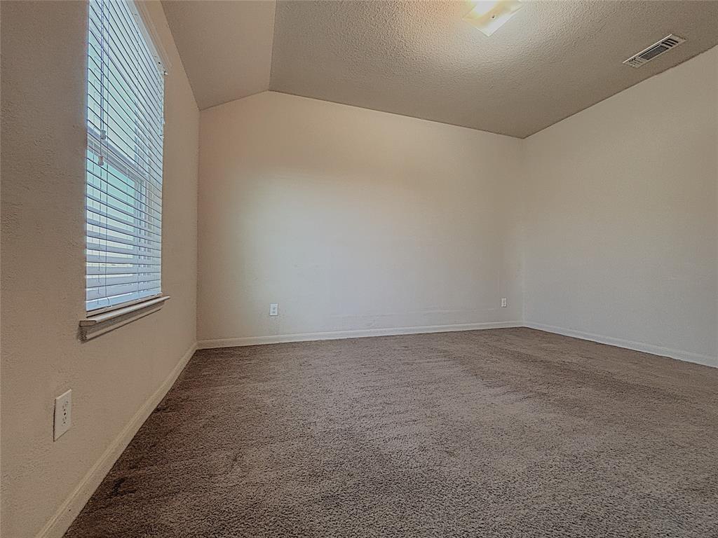 9435 Smoke Tree Drive Forney, TX 75126 - Photo 33 of 36 an empty room with windows
