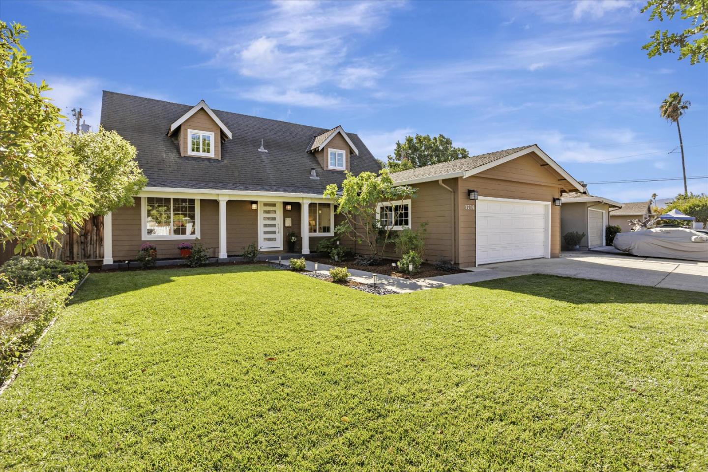 1716 Grizilo Drive San Jose, CA 95124 - Photo 1 of 49 a front view of a house with swimming pool