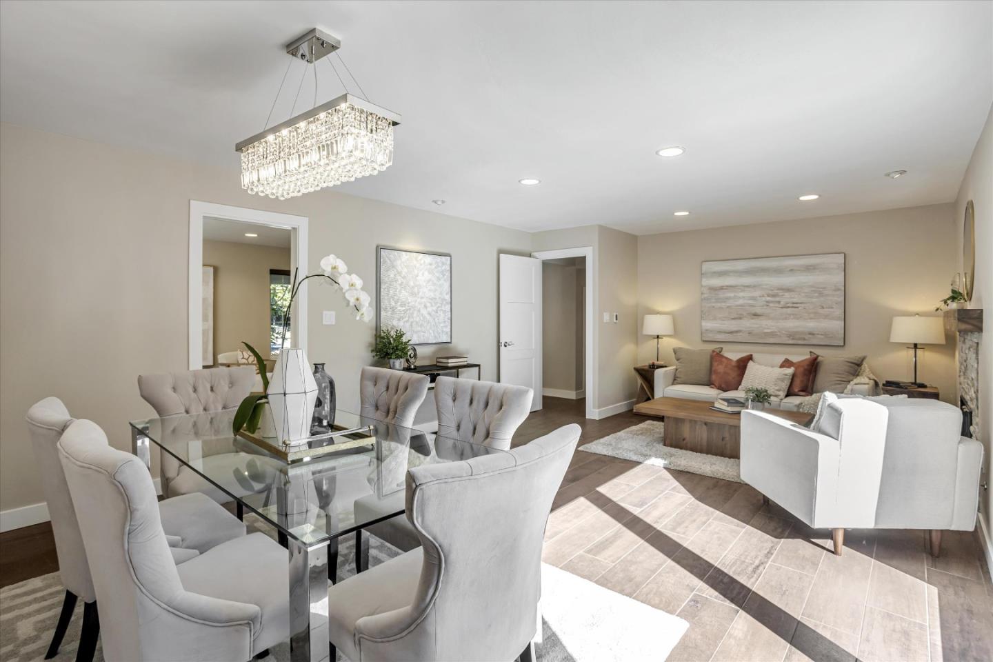 1716 Grizilo Drive San Jose, CA 95124 - Photo 16 of 49 a view of a dining room with furniture a chandelier and wooden floor