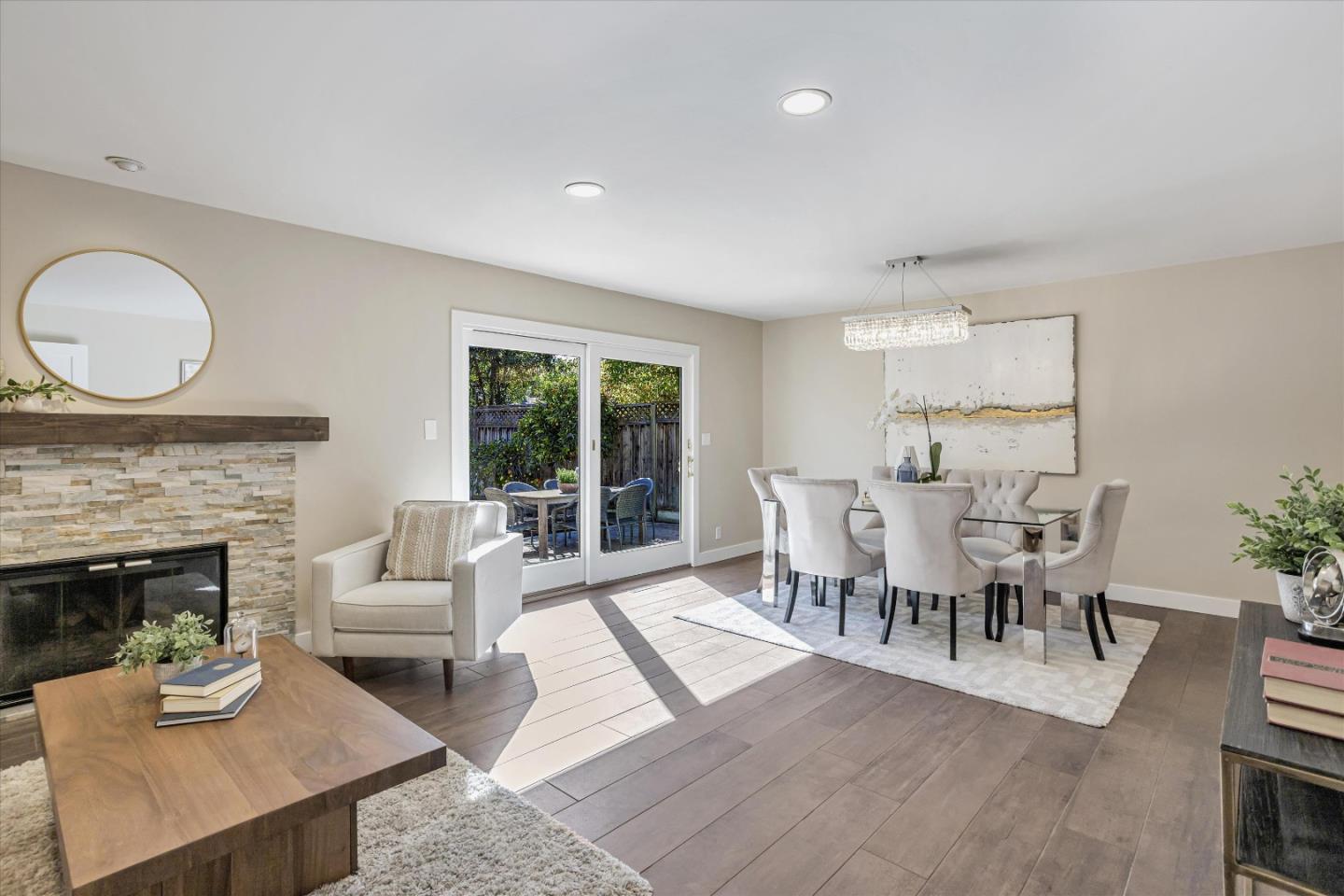 1716 Grizilo Drive San Jose, CA 95124 - Photo 17 of 49 a dining room with furniture a fireplace and wooden floor