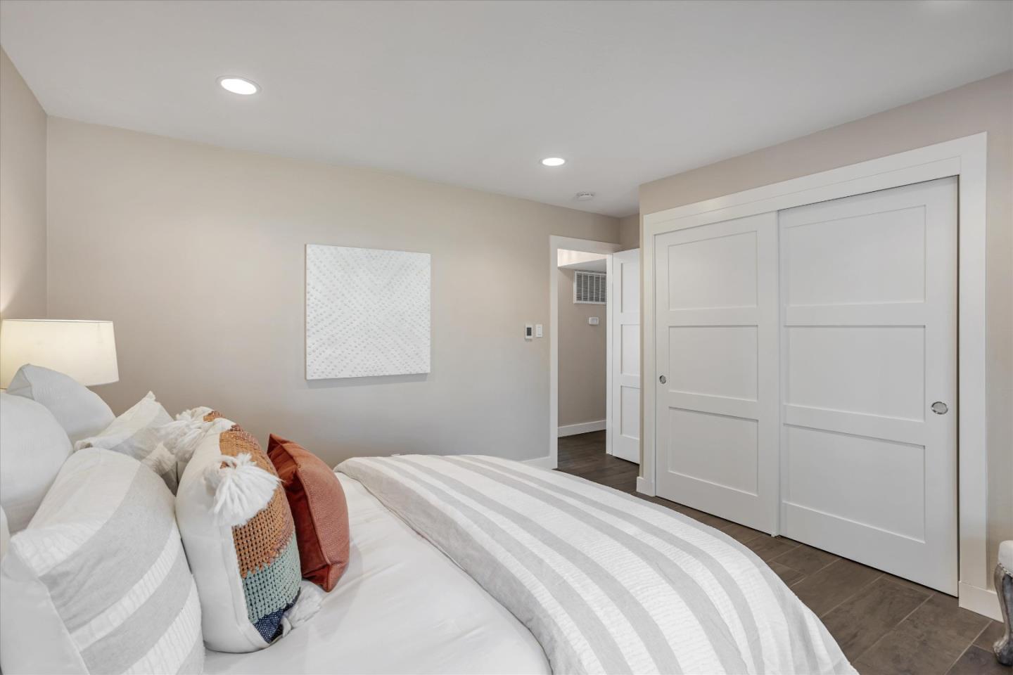 1716 Grizilo Drive San Jose, CA 95124 - Photo 19 of 49 a bedroom with a bed and a painting on the wall