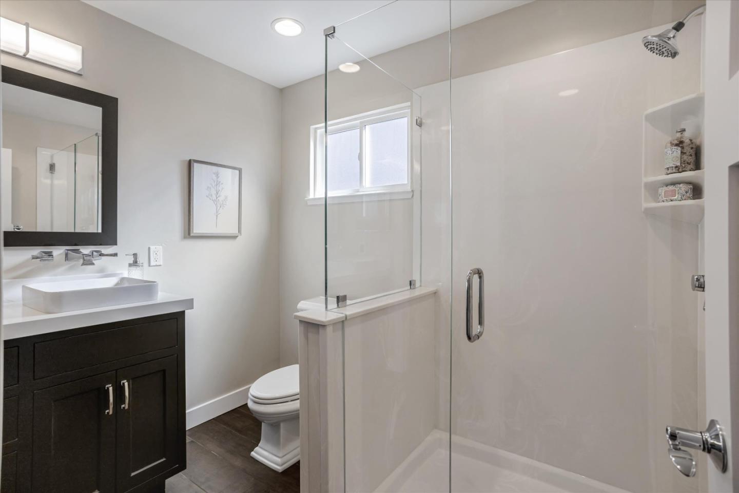 1716 Grizilo Drive San Jose, CA 95124 - Photo 31 of 49 a bathroom with a toilet a sink a mirror and vanity