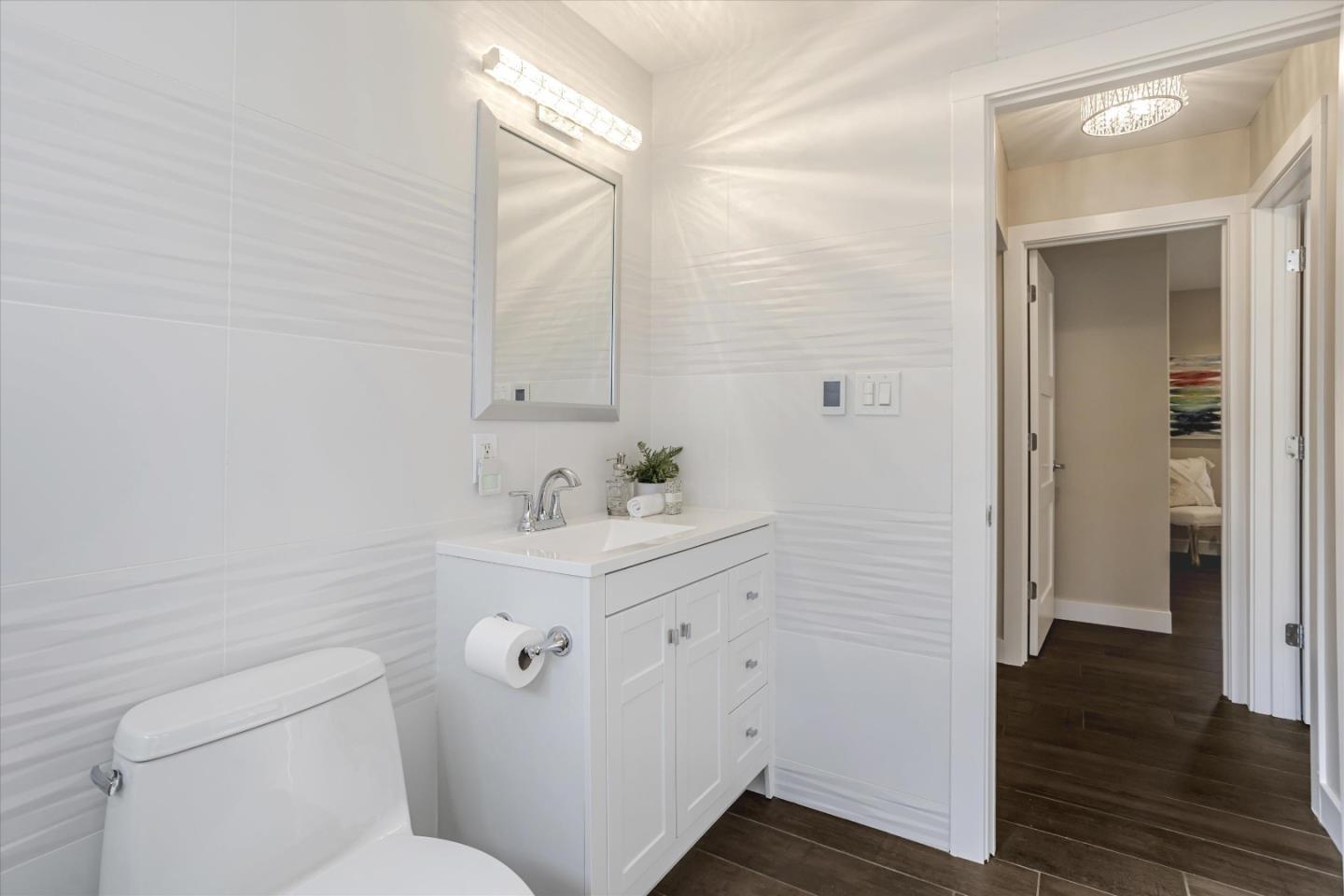 1716 Grizilo Drive San Jose, CA 95124 - Photo 33 of 49 a bathroom with a sink mirror and toilet