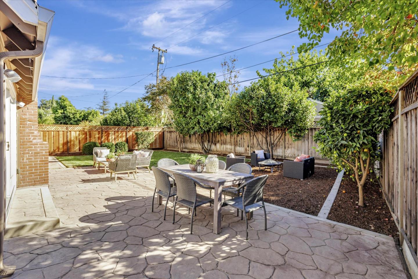 1716 Grizilo Drive San Jose, CA 95124 - Photo 35 of 49 a view of a patio with table and chairs and potted plants