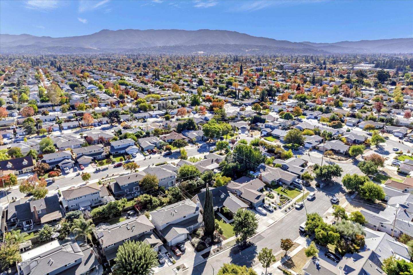 1716 Grizilo Drive San Jose, CA 95124 - Photo 47 of 49 an aerial view of a city with lots of residential buildings and mountain view in back