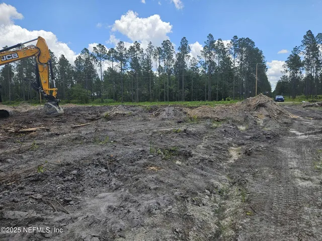 a view of outdoor space with river and trees