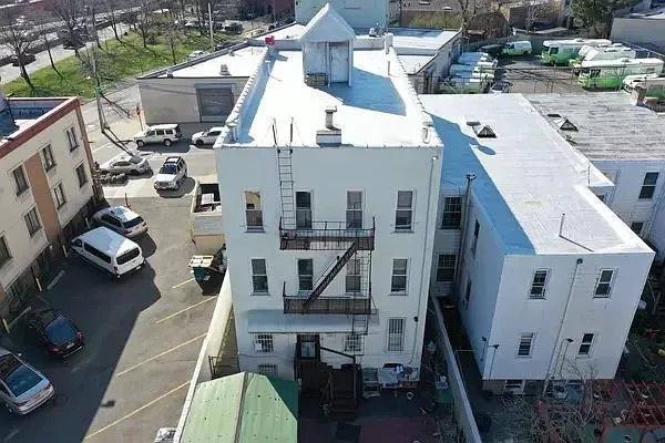 a view of a house with backyard and bathroom