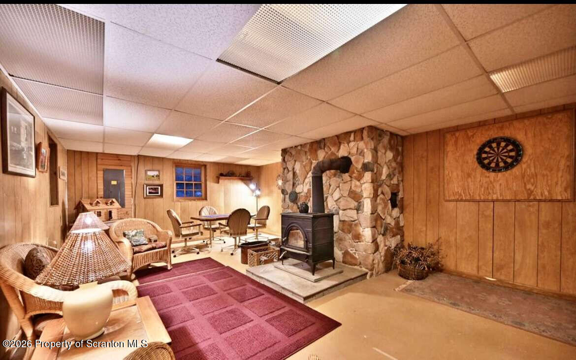 9 East Lake Road Moscow, PA 18444 - Photo 35 of 48 a living room with furniture a flat screen tv and a table