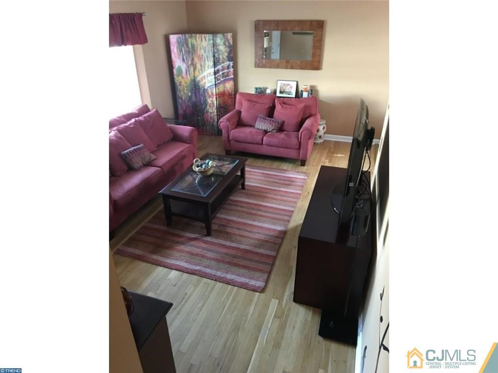 41 Miry Brook Road Hamilton, NJ 08690 - Photo 4 of 11 a living room with furniture and a wooden floor