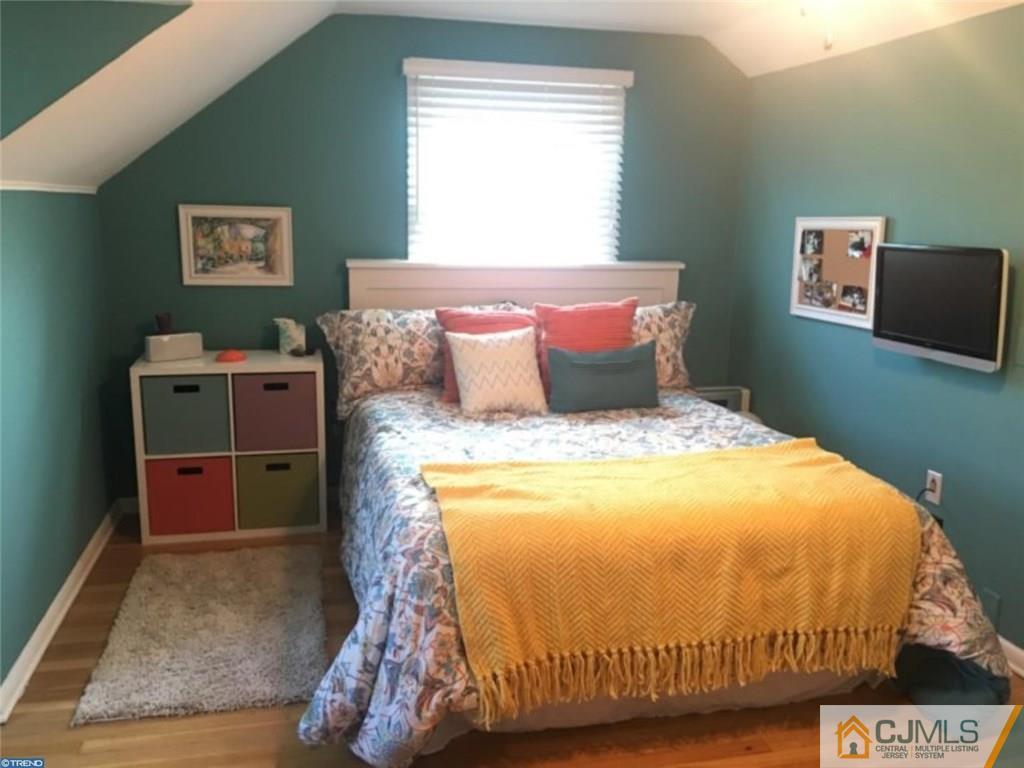 41 Miry Brook Road Hamilton, NJ 08690 - Photo 6 of 11 a bed sitting in a bedroom next to a window