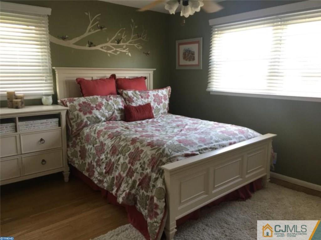 41 Miry Brook Road Hamilton, NJ 08690 - Photo 8 of 11 a bedroom with a bed and a window