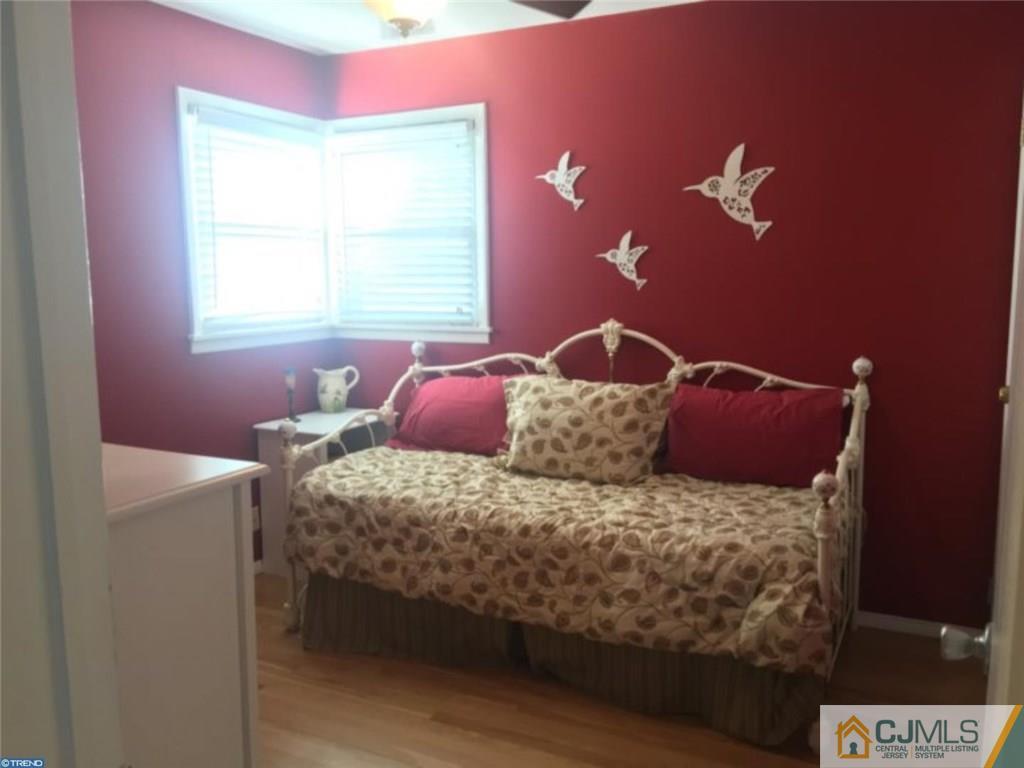 41 Miry Brook Road Hamilton, NJ 08690 - Photo 9 of 11 a bedroom with a bed and a potted plant