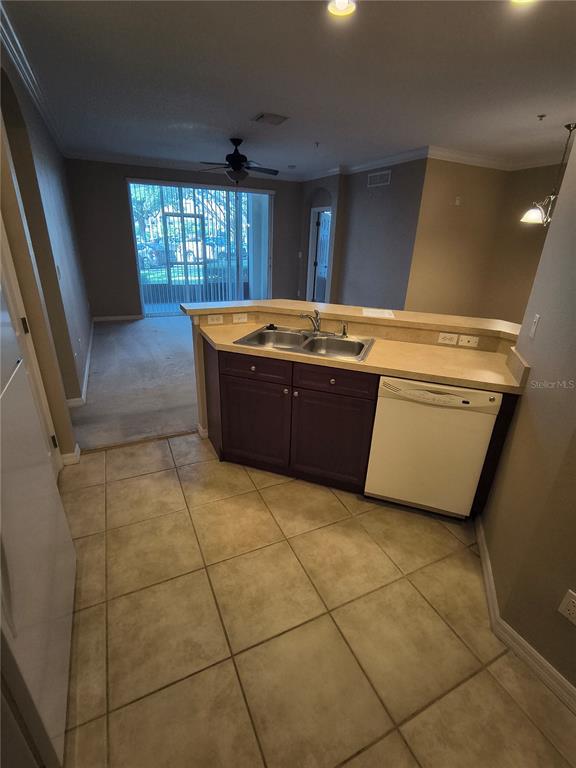 11446 Jasper Kay Terrace, Unit 1009 Windermere, FL 34786 - Photo 15 of 15 a living room with granite countertop furniture a washer and dryer