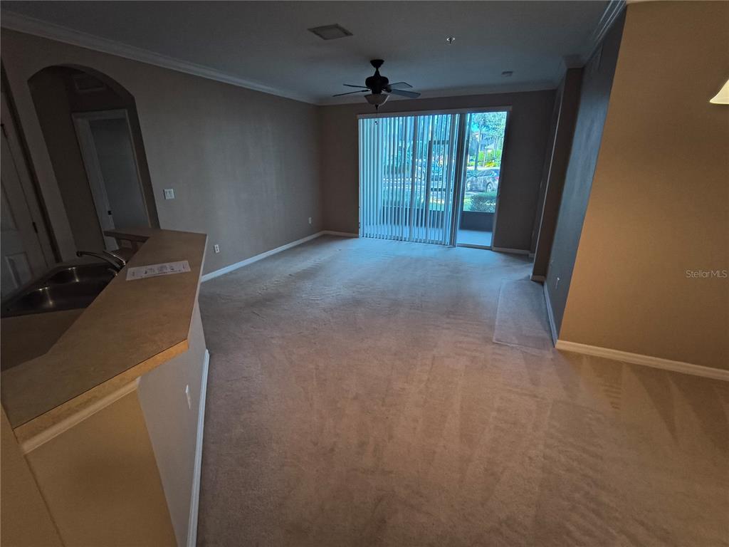 11446 Jasper Kay Terrace, Unit 1009 Windermere, FL 34786 - Photo 3 of 15 an empty room with windows