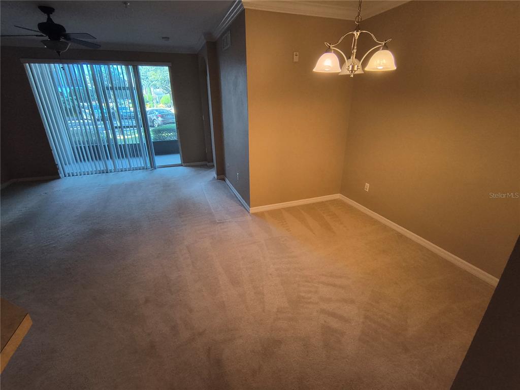 11446 Jasper Kay Terrace, Unit 1009 Windermere, FL 34786 - Photo 4 of 15 wooden floor in an empty room with a window