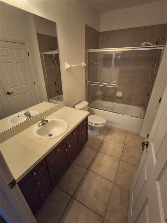 11446 Jasper Kay Terrace, Unit 1009 Windermere, FL 34786 - Photo 10 of 15 a bathroom with a sink a toilet and shower