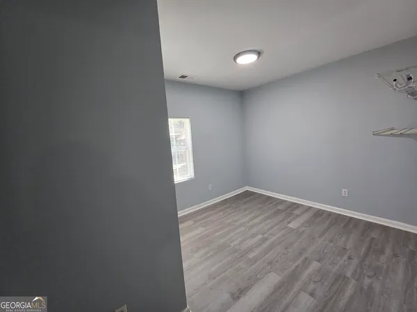 a view of an empty room and window