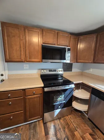 a kitchen with a stove microwave and sink