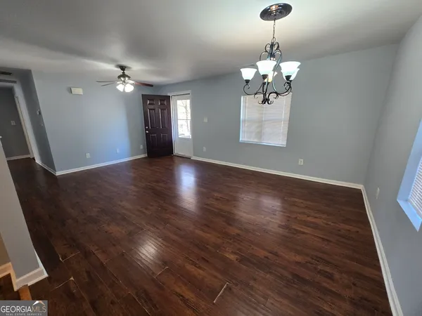 a view of livingroom with hardwood floor and ceiling fan