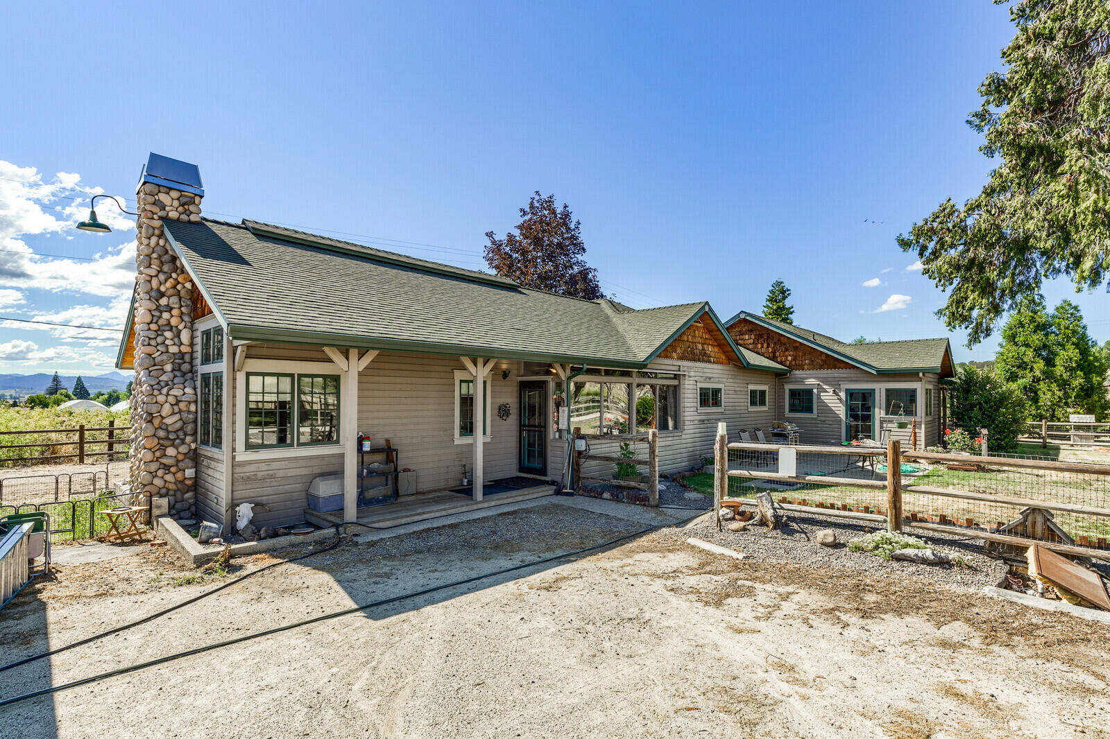 4450 Fern Valley Road Medford, OR 97504 - Photo 37 of 74 a front view of a house with a yard and potted plants