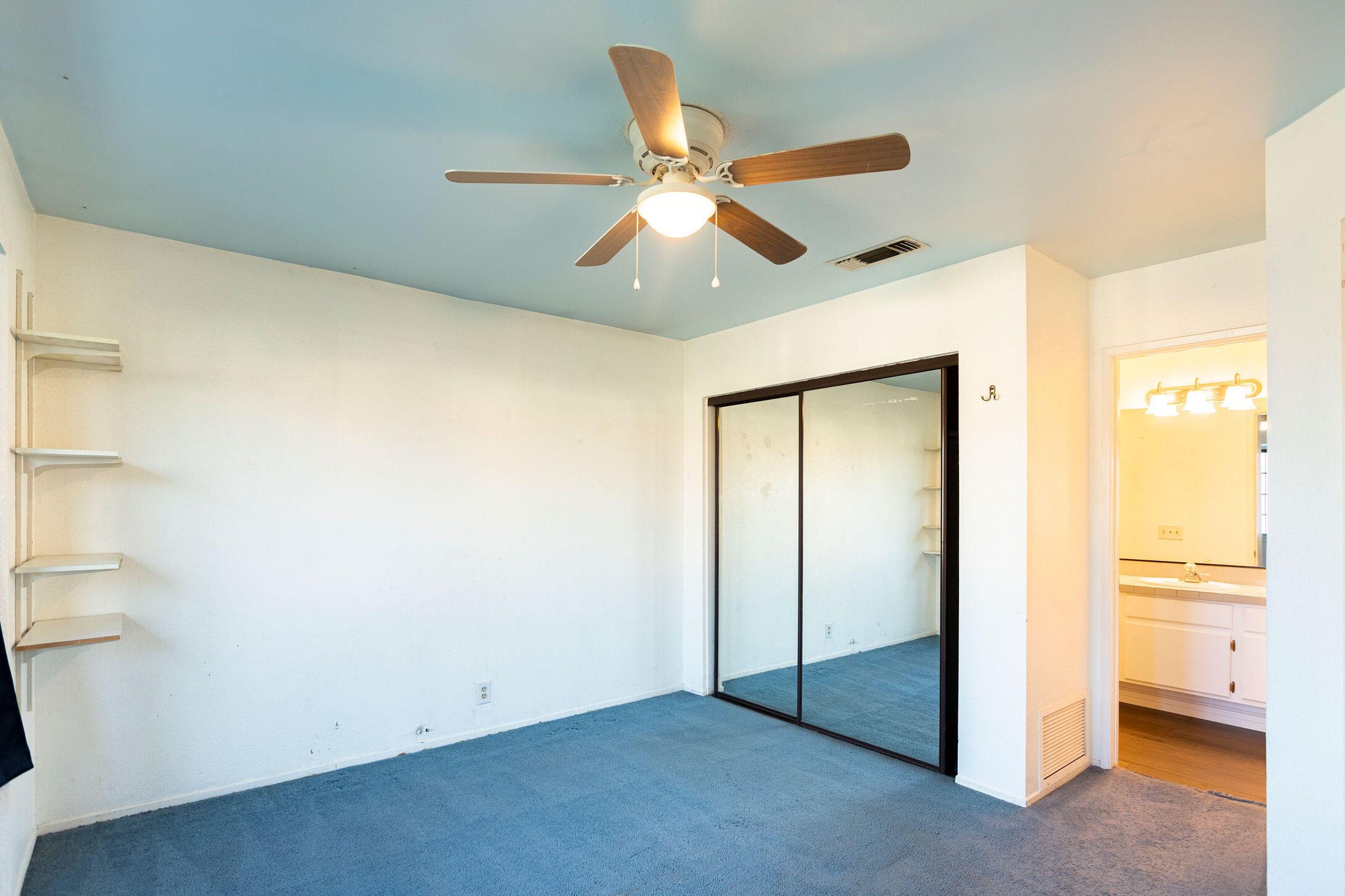 41865 Petersfield Road Bermuda Dunes, CA 92203 - Photo 14 of 26 a view of an empty room and window with a ceiling fan