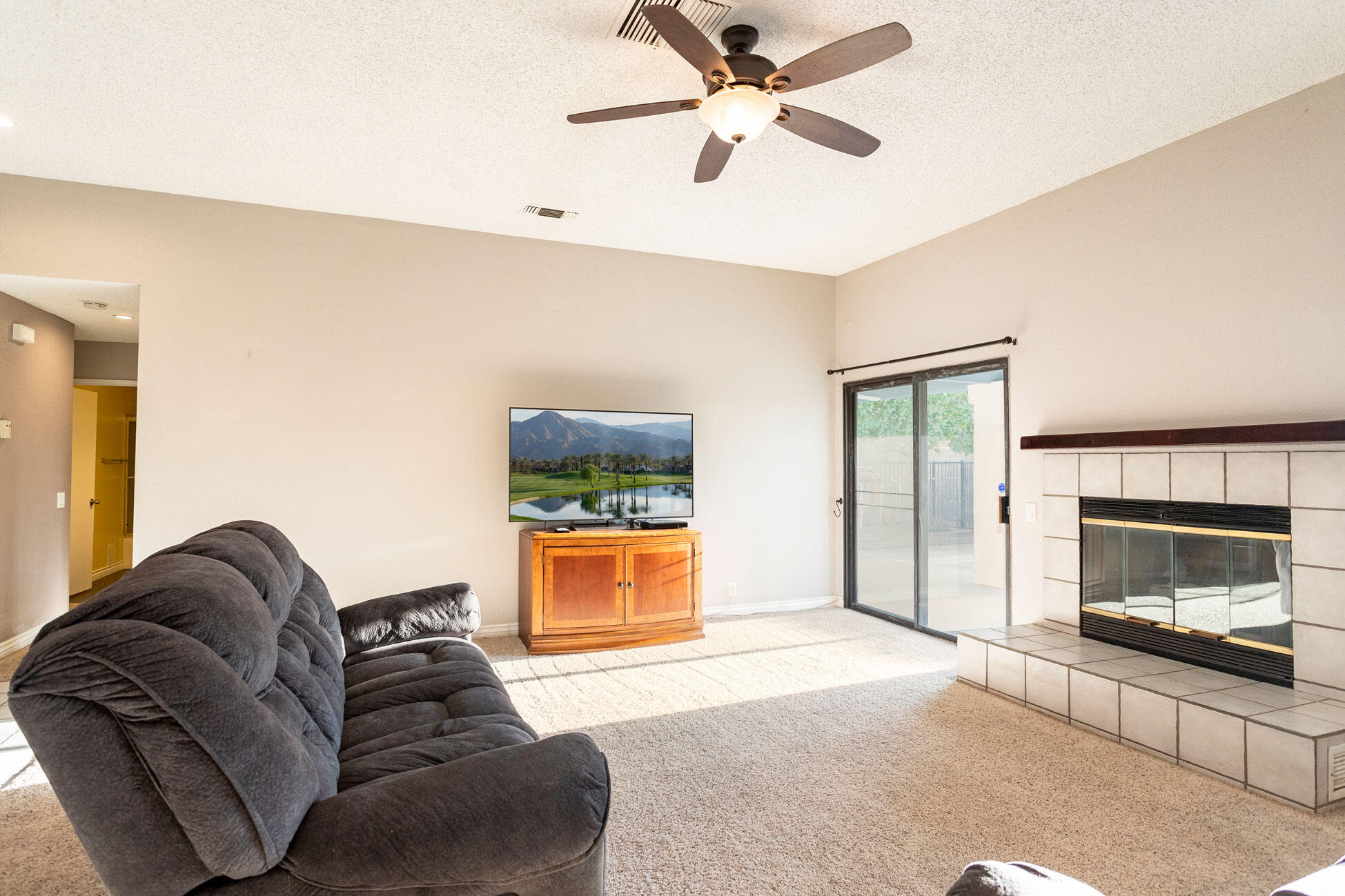 41865 Petersfield Road Bermuda Dunes, CA 92203 - Photo 8 of 26 a living room with furniture and a fireplace