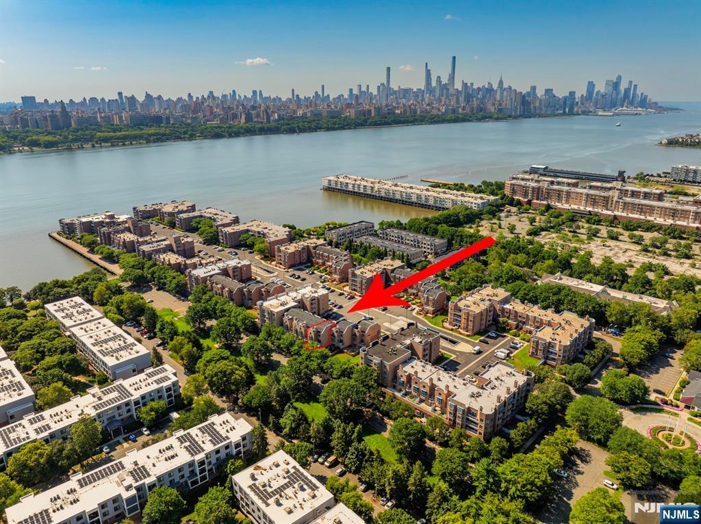 an aerial view of a houses with outdoor space and lake view
