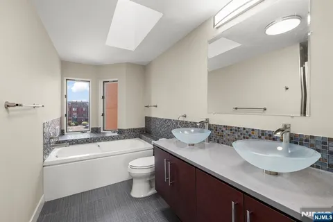 a bathroom with a bathtub and shower