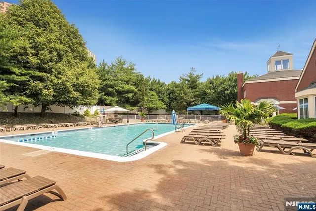 a view of a swimming pool with a patio