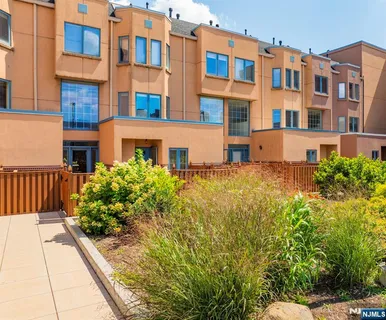 a view of a building next to a yard