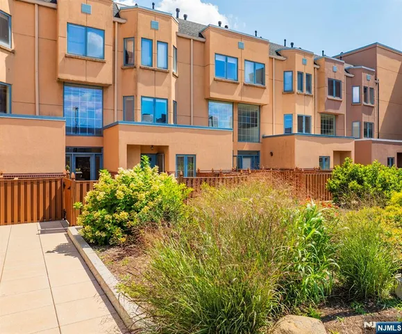 a view of a building next to a yard
