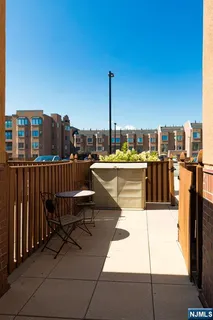 a view of hallway with wooden floor