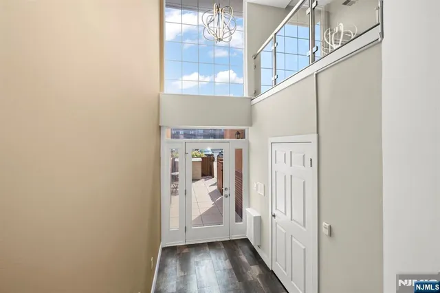 a view of hallway with wooden floor