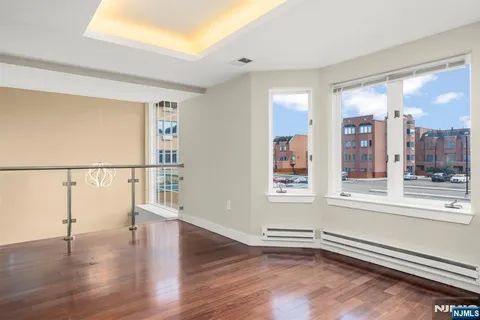 a view of entryway with wooden floor