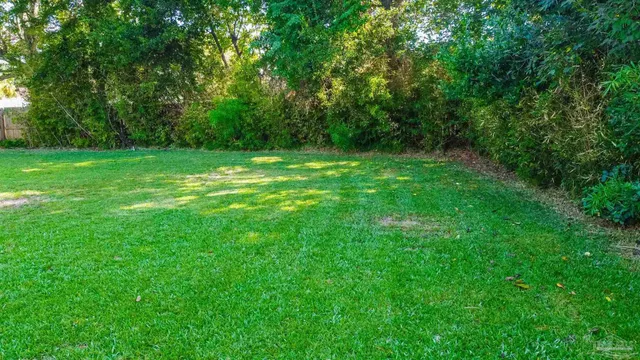 a view of outdoor space with deck and yard