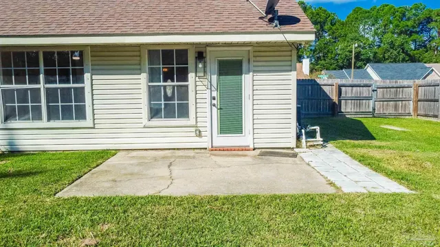 a front view of a house with a yard and a garage