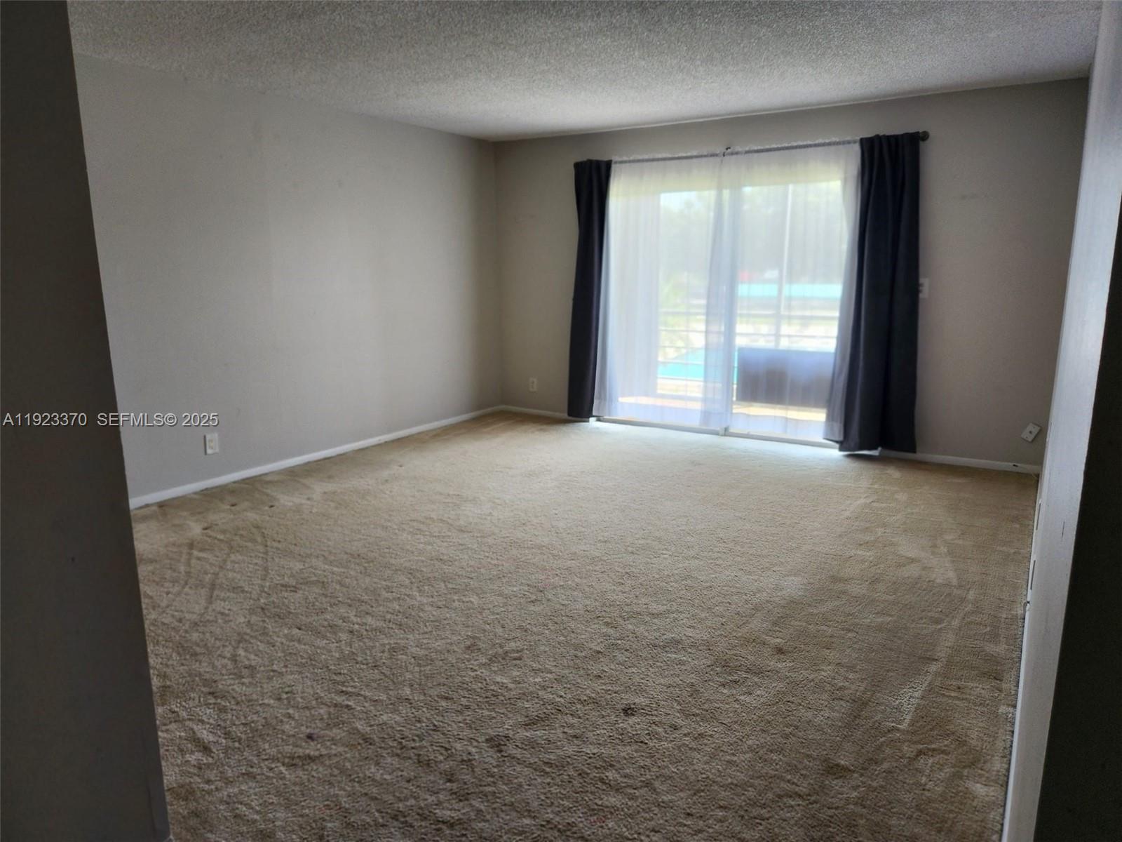 4100 North 58th Avenue, Unit 207 Hollywood, FL 33021 - Photo 2 of 6 an empty room with windows