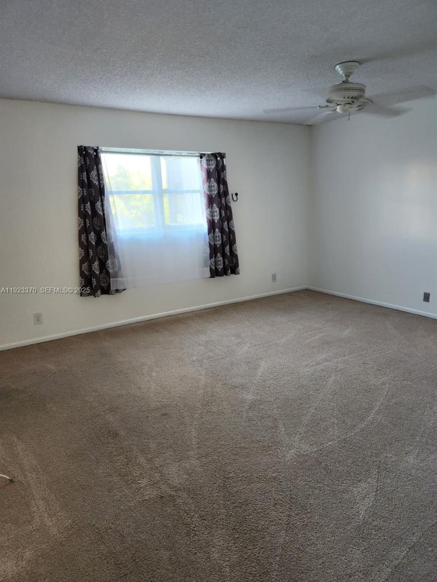 4100 North 58th Avenue, Unit 207 Hollywood, FL 33021 - Photo 4 of 6 an empty room with windows
