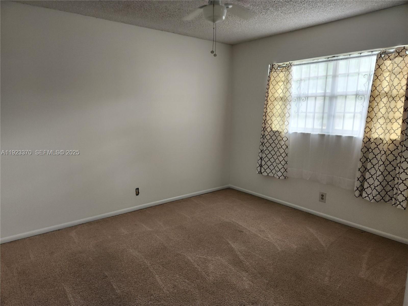4100 North 58th Avenue, Unit 207 Hollywood, FL 33021 - Photo 5 of 6 an empty room with a window