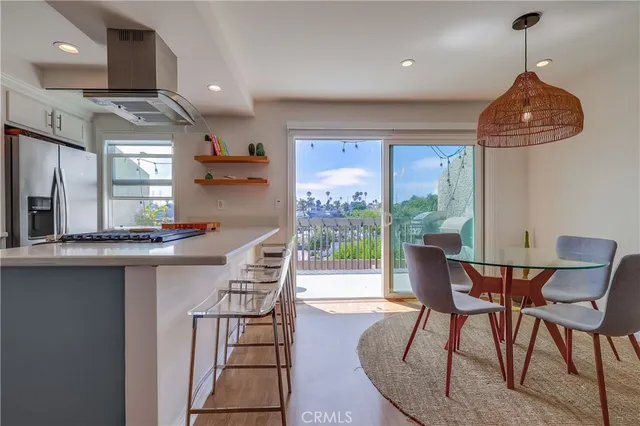 a kitchen with stainless steel appliances granite countertop white cabinets sink and dishwasher