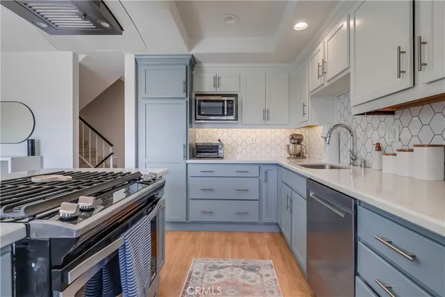 a view of a patio with couches and potted plants