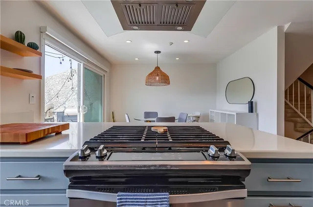 a living room with furniture a window and flat screen tv