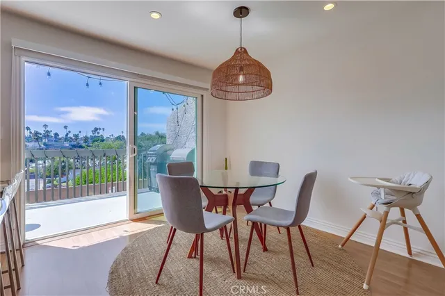 a view of a dining room with furniture wooden floor and chandelier