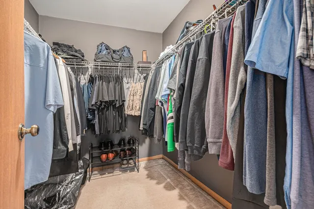 a view of a house with a yard and a patio